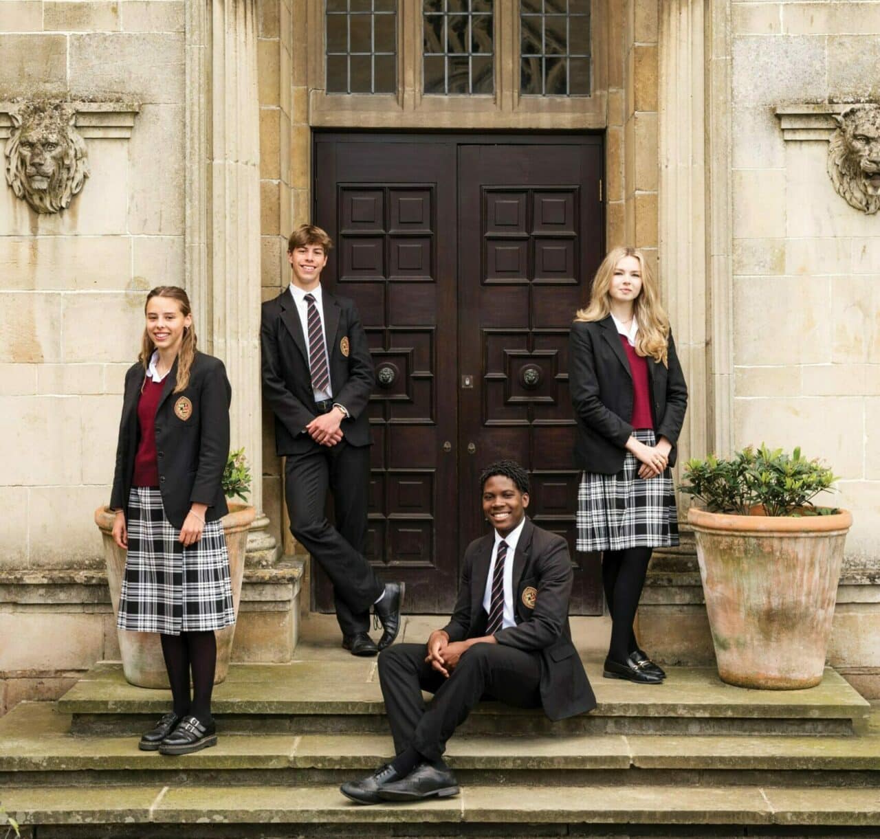 Oakham School pupils standing outside door