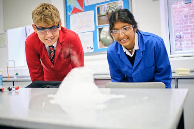 Boy and girl taking part in science experiment