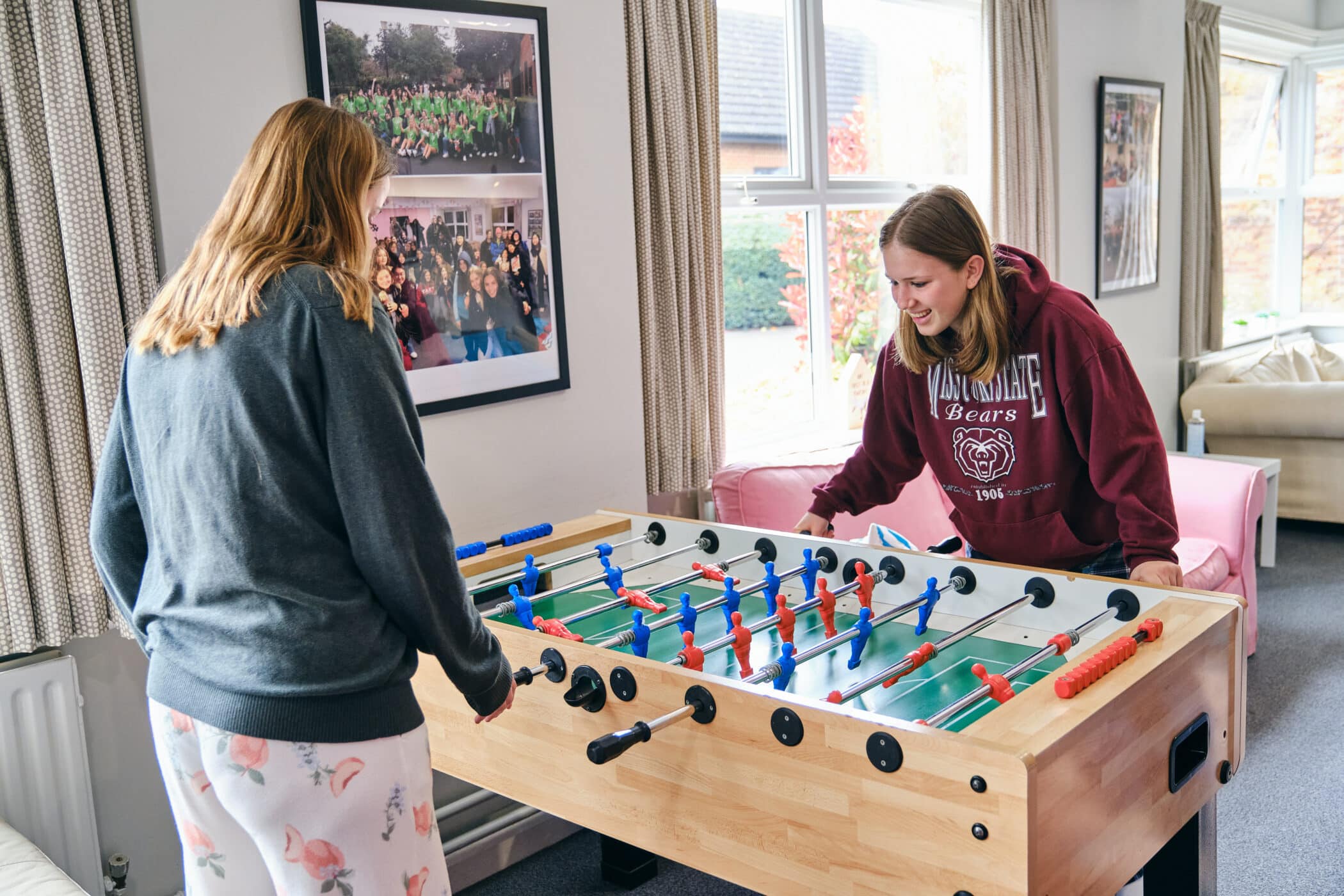 Rushebrookes girls playing table football