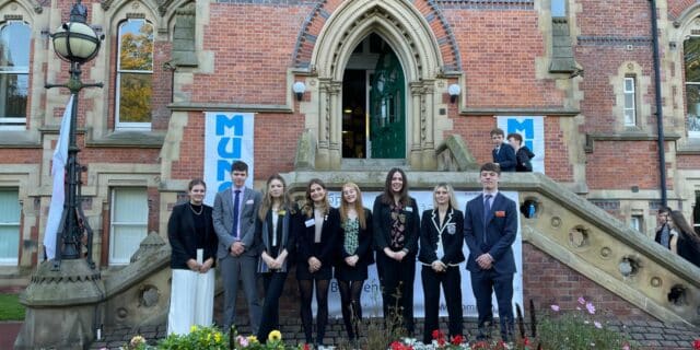 Pupils standing outside building MUN