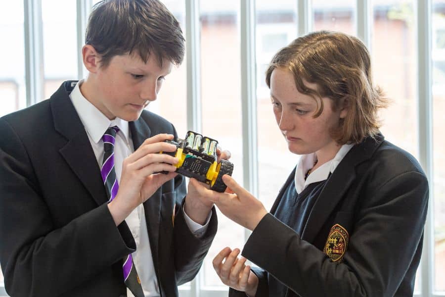 Two pupils looking at device