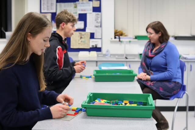 Pupils being interviewed whilst building Lego houses