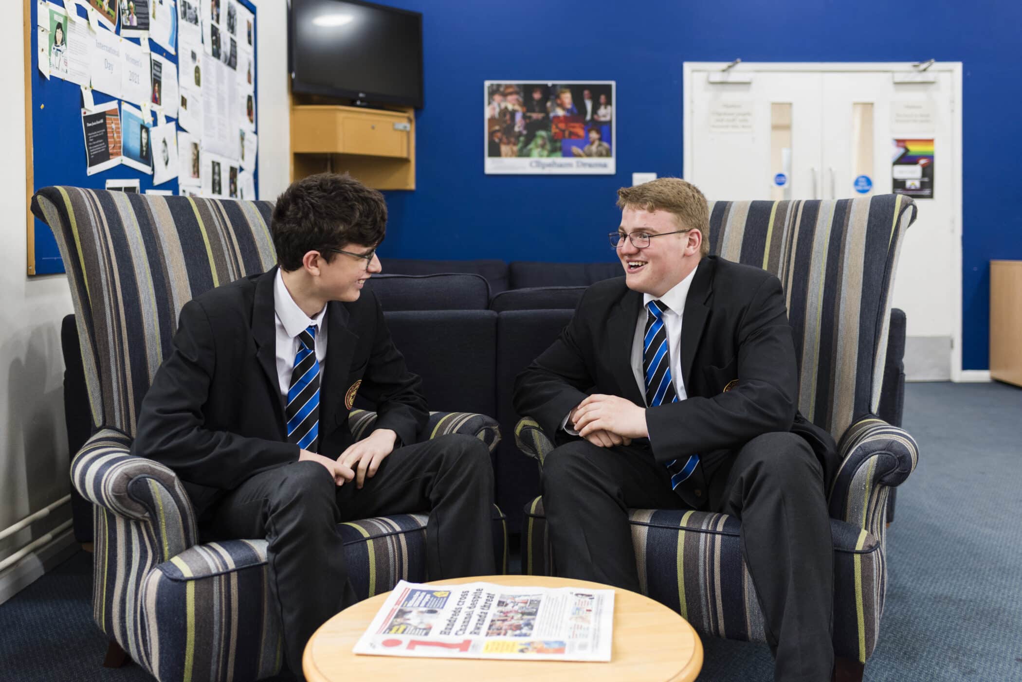 Clipsham House boys sitting on chairs laughing