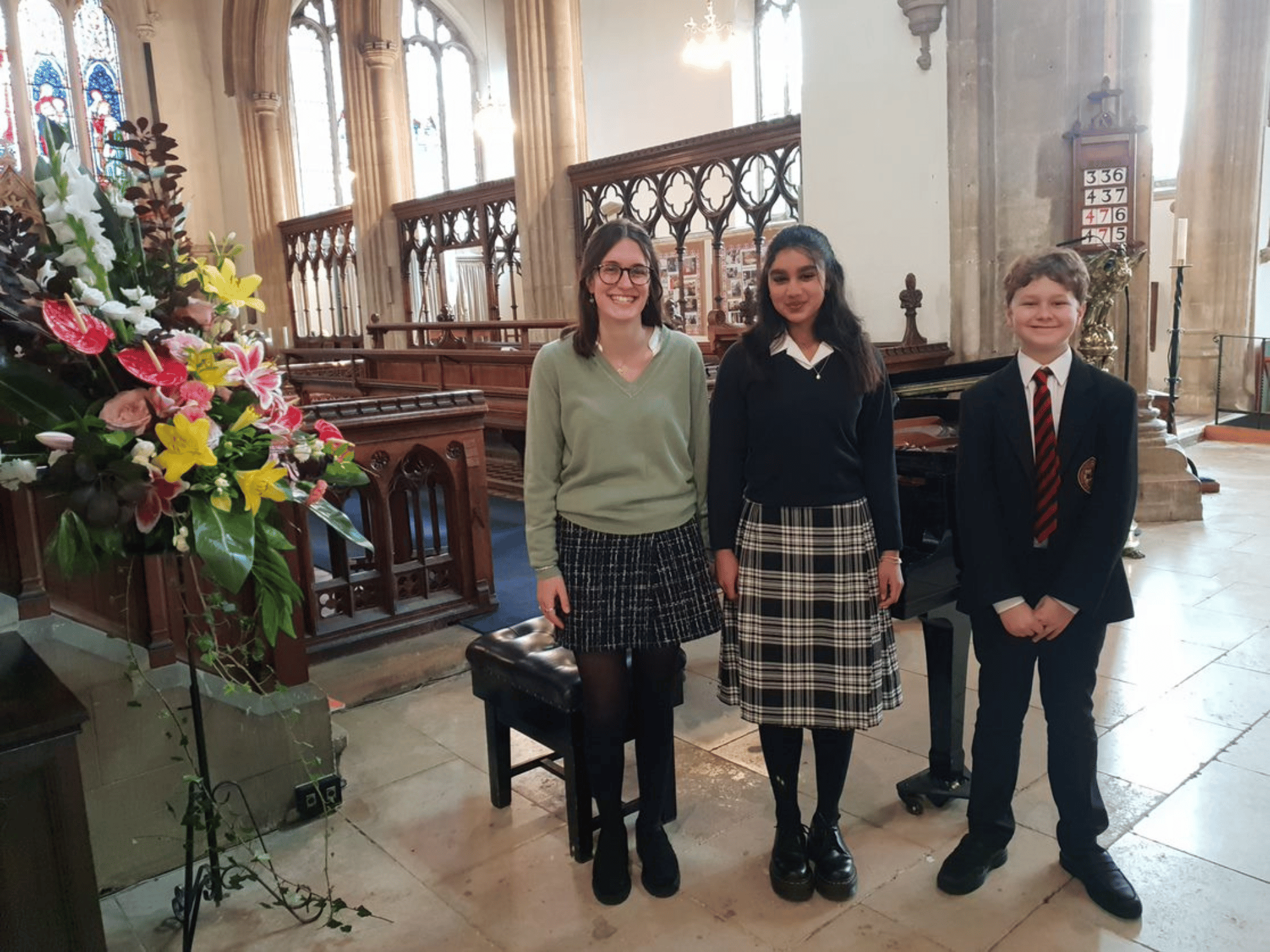 Three students about to sing in a concert