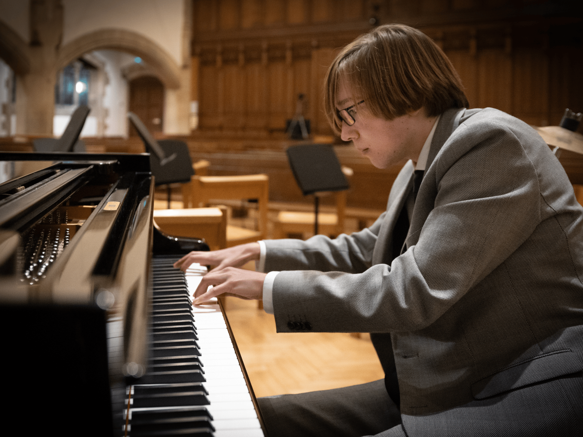 Student plays piano solo in concert