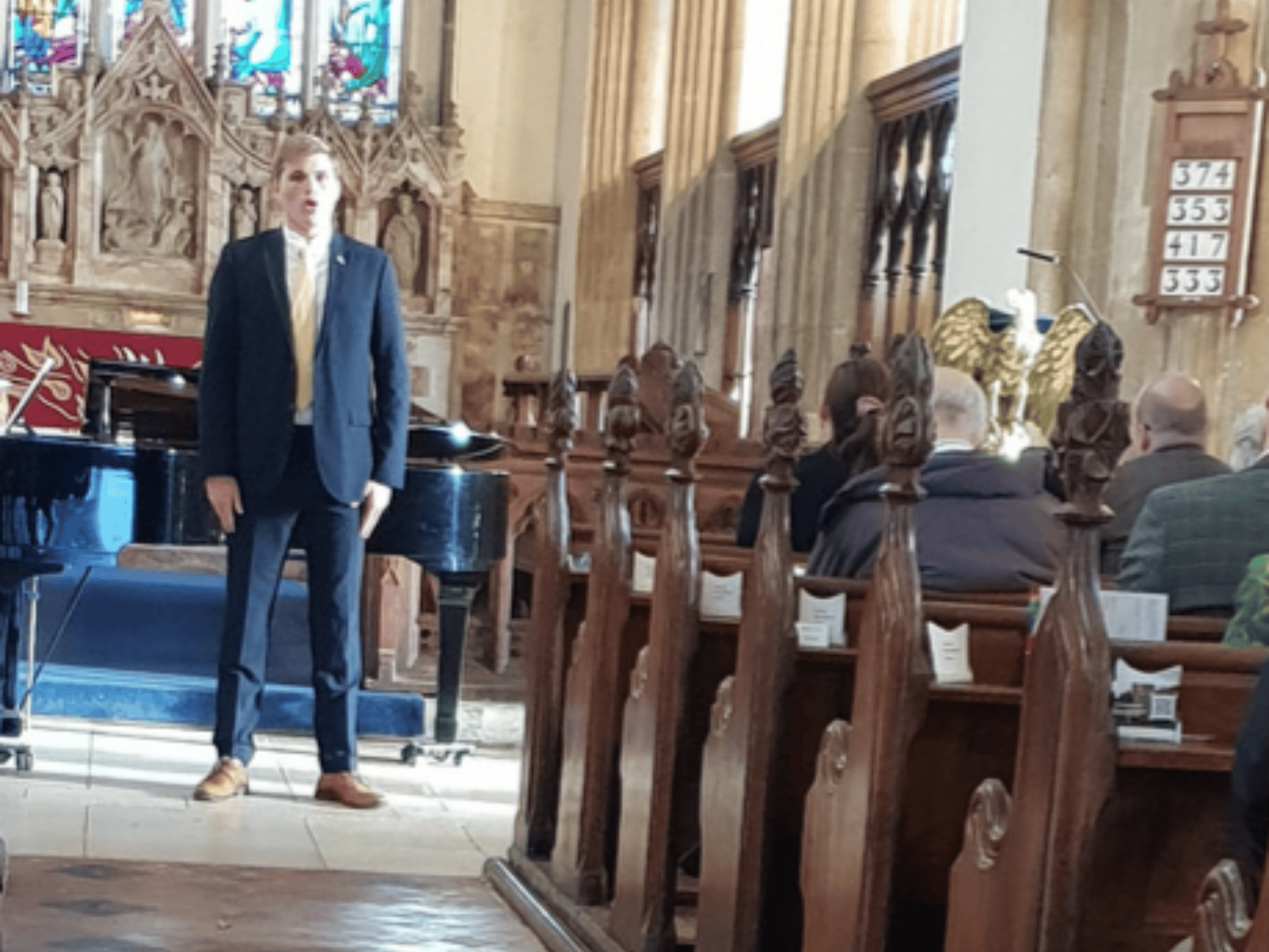 Student sings in a concert in church