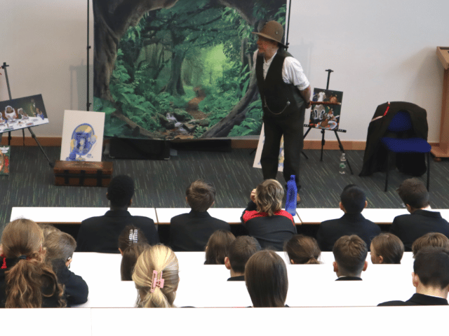 Mark Fraser telling stories to pupils