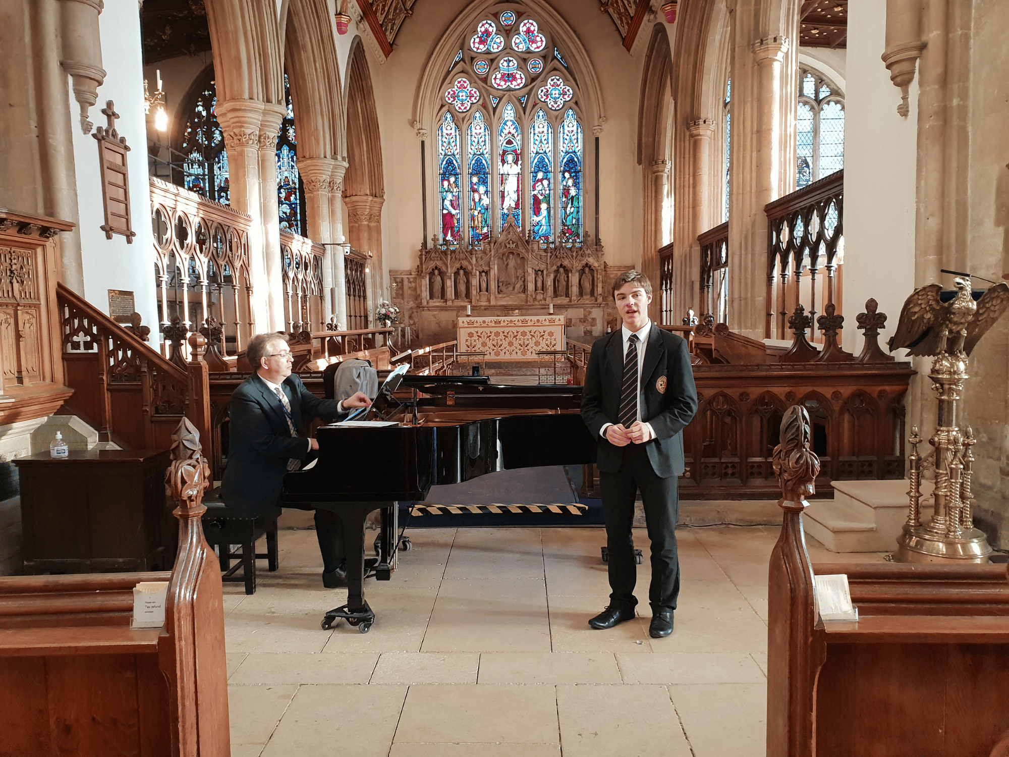 Student sings with piano in lunchtime concert