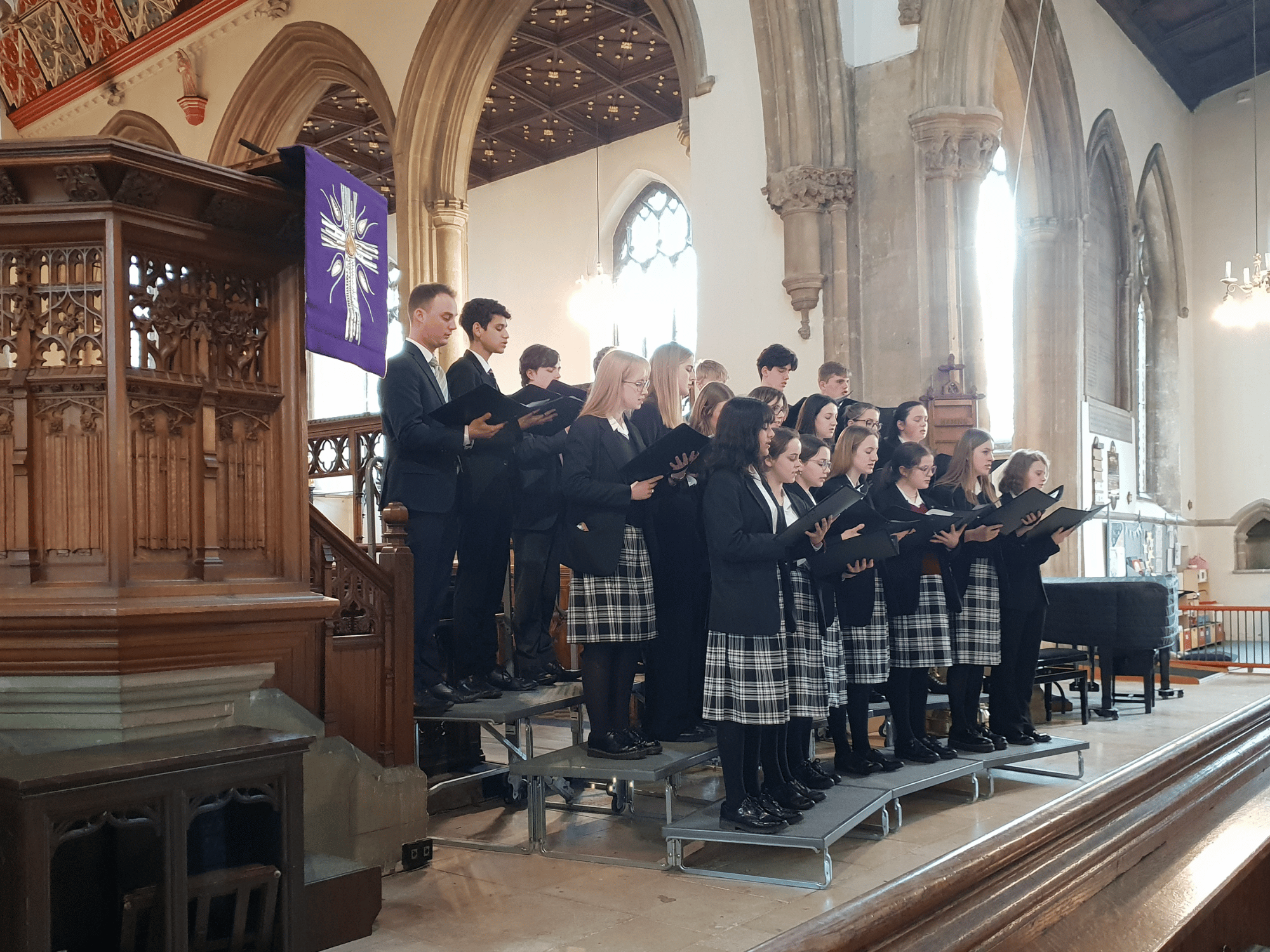 School choir sing in church in a concert