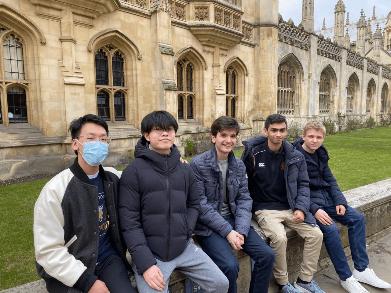 Pupils sitting on wall in Cambridge during their Chemistry race day