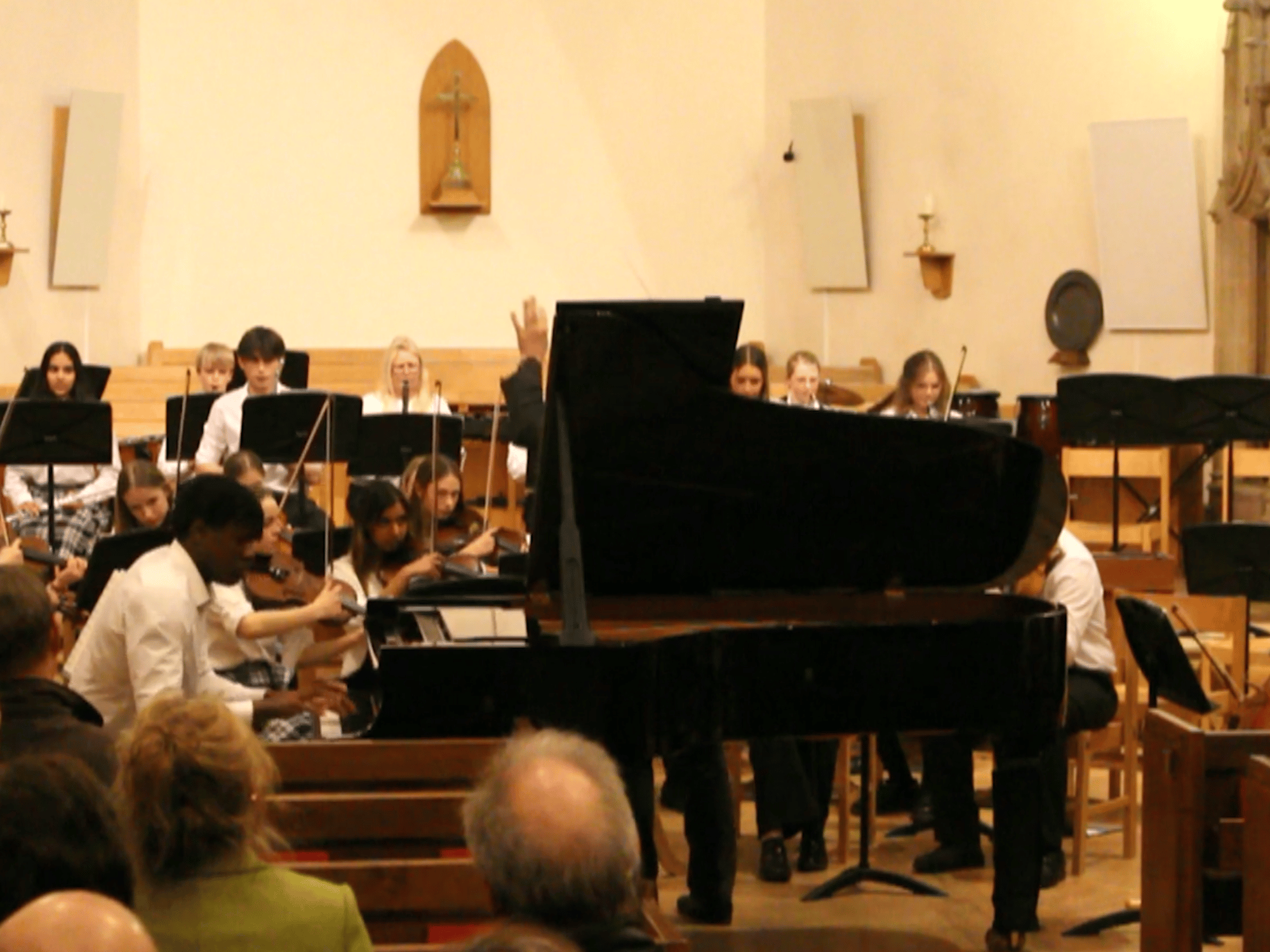 Student plays piano concerto in concert in Chapel