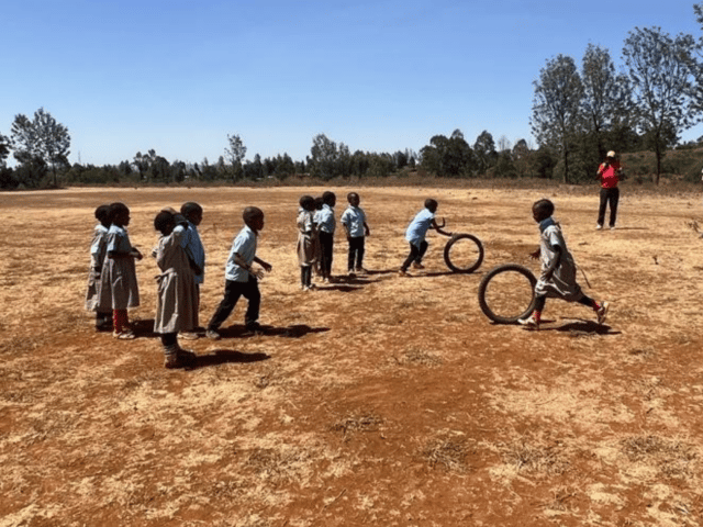 Pupils showing off their tyre rolling skills