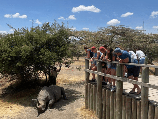 Kenya trip safari pupils looking at a rhino