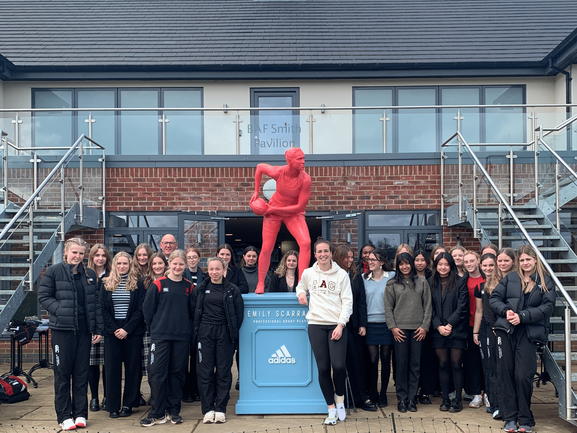 Group of pupils with Rugby Star Emily Scarratt