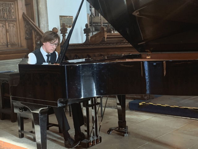 Pupil playing the piano