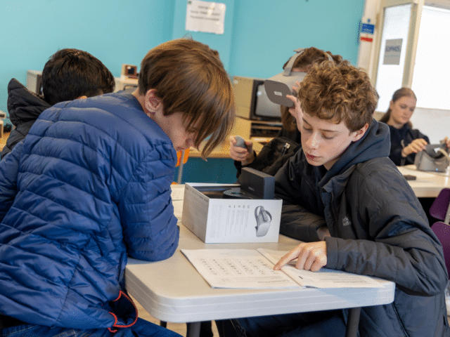 Pupils looking at some work