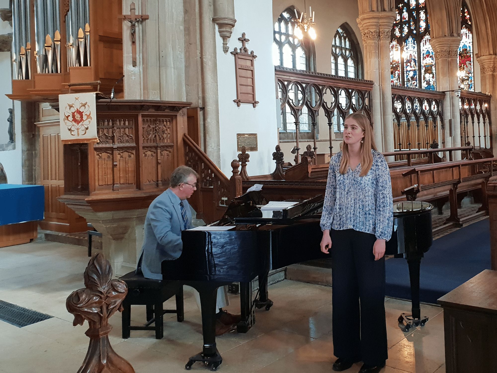 Student sings in church in concert