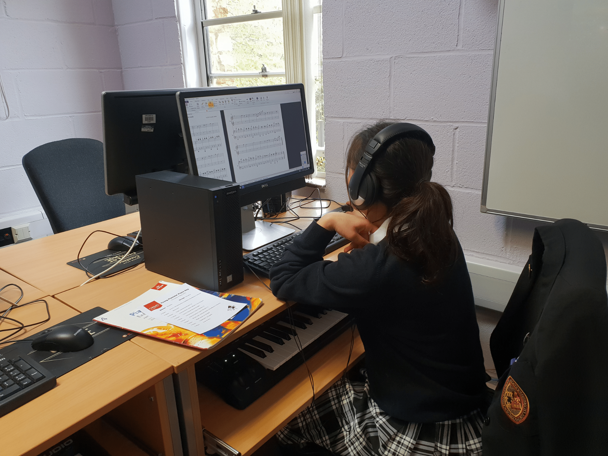 Student composes at computer