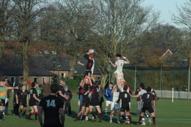 Fred Warburton playing rugby for Oakham School as a pupil in 2012