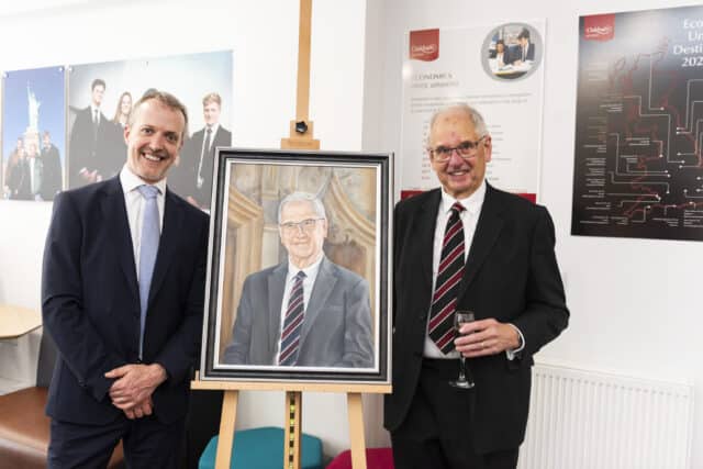 Geraint Davies and Peter Lawson standing next to portrait.